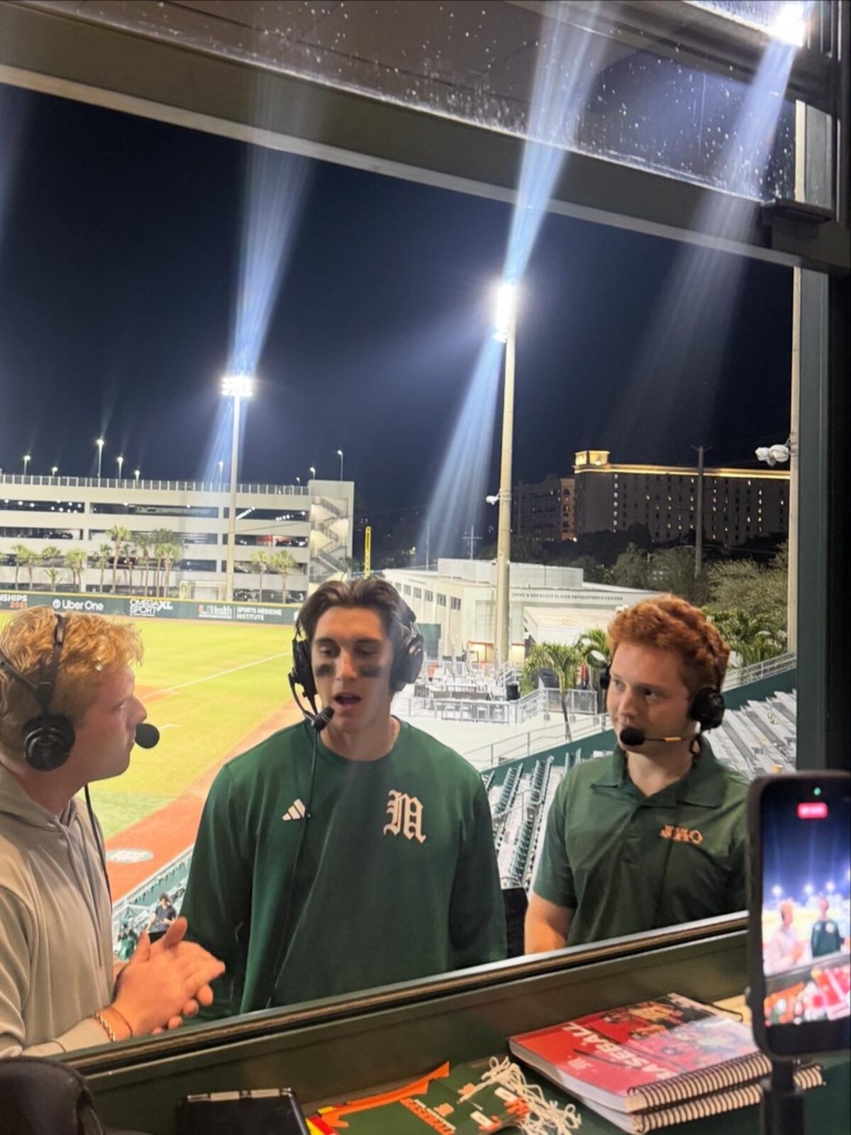 Carter Lutz interviewing a Miami player from the broadcast booth